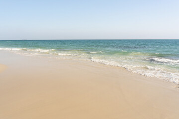 Fototapeta na wymiar Beach and waves tropical sea with blue sky on sunny day background. copy space