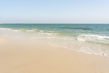 Beach and waves tropical sea with blue sky on sunny day background. copy space