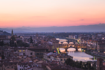 A sunset view of old town Florence cityscape skyline, River Arno and Ponte Vecchio from Piazzale Michelangelo.
