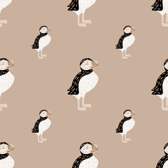 Pastel palette seamless wild nature pattern with puffin bird silhouettes. Beige pale background. Simple design.