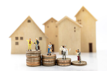 Miniature people: Elderly person standing on coins stack with home, Retirement planning concept.