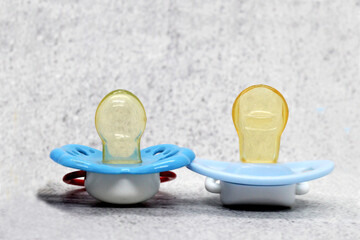 Two Blue baby pacifiers