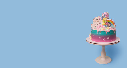 Banner with beautiful festive with unicorn children's cake on a stand on a blue background