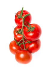 a brush of six large tomatoes on a white background. Studio photo, isolate, tomatoes, washed