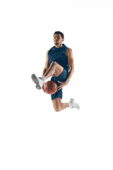 Up to win. Young arabian muscular basketball player in action, motion isolated on white background....