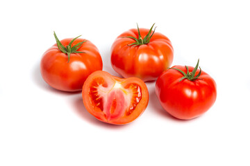 a group of tomatoes on a white background, with shadows. One tomato cut, studio photo, isolate, tomatoes washed