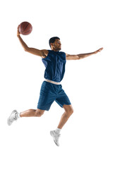 Slam dunk. Young arabian muscular basketball player in action, motion isolated on white background....