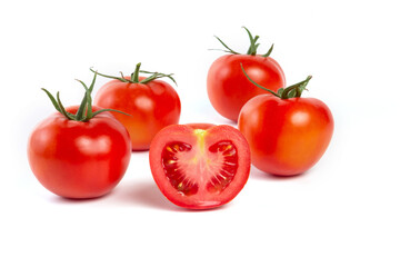 a group of tomatoes on a white background, with shadows. One tomato cut, studio photo, isolate, tomatoes washed