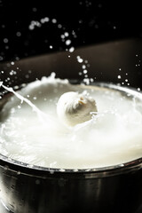 Italian hard cheese silano or caciocavallo in cheesemaker hands. The homemade cheese maker produces...