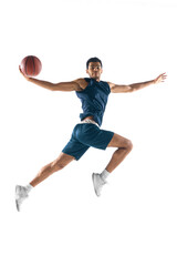 High flight. Young arabian muscular basketball player in action, motion isolated on white background. Concept of sport, movement, energy and dynamic, healthy lifestyle. Training, practicing.