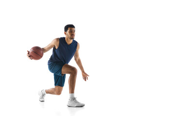 Strategy. Young arabian muscular basketball player in action, motion isolated on white background....