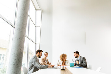 Fototapeta premium Multiethnic young business people working together in the office