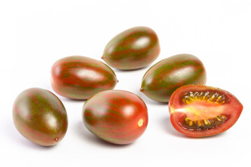 a few tomatoes on a white background with a shadow.