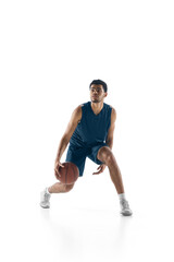 Plakat Leader. Young arabian muscular basketball player in action, motion isolated on white background. Concept of sport, movement, energy and dynamic, healthy lifestyle. Training, practicing.