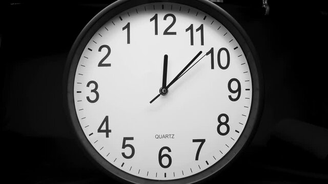 A look of the wall clock on a counter clockwise movement inside the house