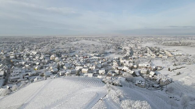 Snowy Village Houses Rooftop View From The Snowy Hilltop With Vineyard In Zell-Weierbach, Offenburg, Germany - Aerial Drone Shot, Forward
