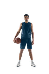 Unstoppable. Young arabian muscular basketball player posing confident isolated on white background. Concept of sport, movement, energy and dynamic, healthy lifestyle. Training, practicing.