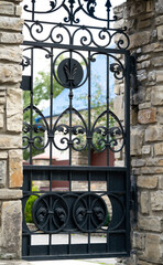 Wrought-iron door, ornamental forging, forged elements close-up.