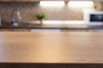 blurred kitchen interior and wooden desk space home background