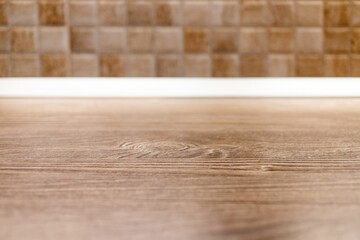 wooden desk space and tiles home background with copy space
