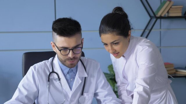 Professional medical doctors working in hospital office. Discussion with the chief physician and the young nurse. Medical concept.