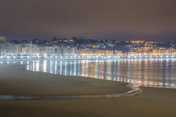 Evening low tide at La Concha Beach in San Sebastian, Basque Autonomous Community in Spain