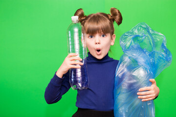 Girl hold trash bag and plastic bottle and shows interest in environmental issues isolated on green background. Child accustomed to bear responsibility for garbage since childhood. Plastic trash