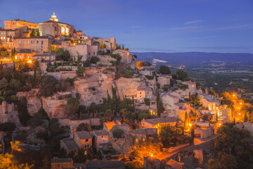 A stunning summer's evening view of the beautiful and historic hilltop village of Gordes, in Provence France