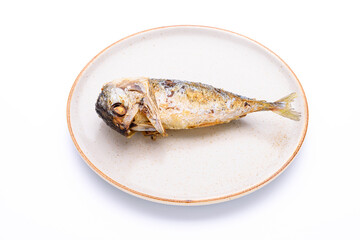 Delicious fried mackerel in a plate on a white background - top view
