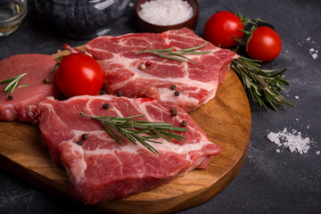 Barbecue Rib Eye Steak on wooden cutting board at kitchen table