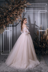 Fototapeta premium young girl in a luxurious wedding dress
