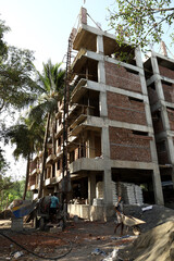 Fototapeta na wymiar A under construction building and apartment with 4 floors and 1 ground floor