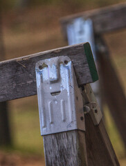 A face appears on a sawhorse clamp.