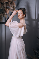 Fototapeta na wymiar young girl in a luxurious wedding dress