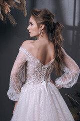 Fototapeta premium young girl in a luxurious wedding dress
