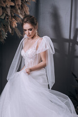 Fototapeta premium young girl in a luxurious wedding dress