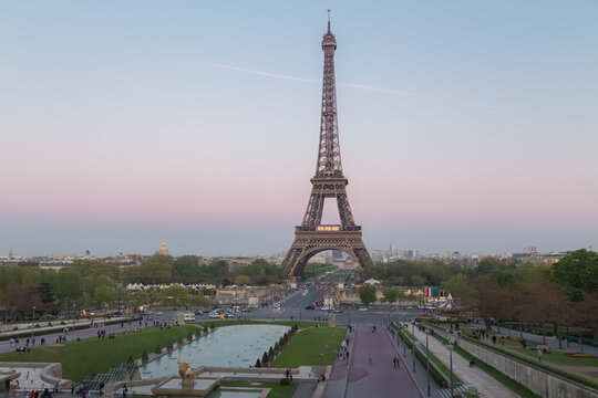 The iconic tourist attraction Eiffel Tower in Paris, France with a pastel coloured sky taken from Palais de Chaillot.
