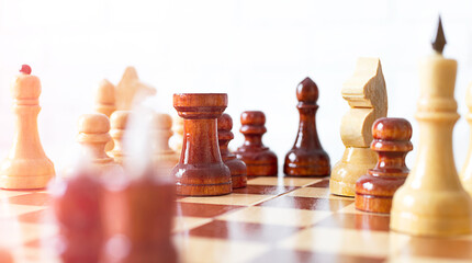 close-up chess pieces on a chessboard during the game