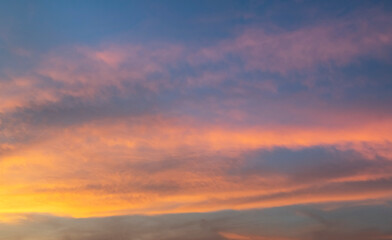 Fototapeta na wymiar Beautiful colorful bright sunset sky with orange clouds. Nature sky background. Dramatic sunset.