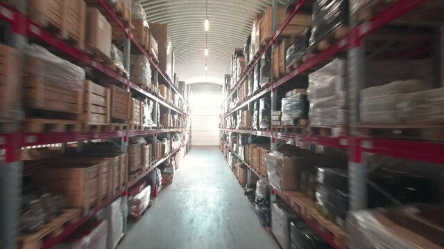 Warehouse or stock of materials, racks, boxes, containers. Shelves with goods or commodity