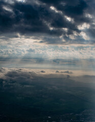 landscape of the hills from the sky with sunlight rays; vintage style