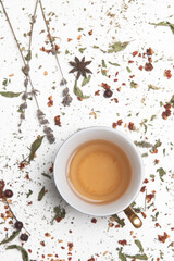 Herbal tea, top view. Dry herbs and tea cup on white. Herbs in bulk, zero waste and eco-friendly lifestyle, herbal medicine concept.