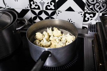 Cauliflower in cooking pot. Professional kitchen