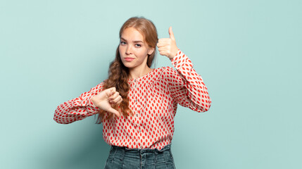 blonde pretty woman feeling confused, clueless and unsure, weighting the good and bad in different...