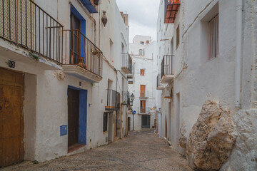 A quiet alley in the heart of the old town of Peniscola, Spain, an historical coastal town characterised by it white wash homes and architecture