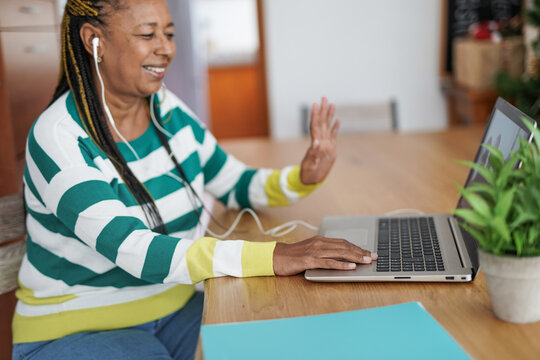 African Senior Woman Having Fun On A Video Call With Family - Social Distance For Coronaviurs - Elderly Generation And Technology