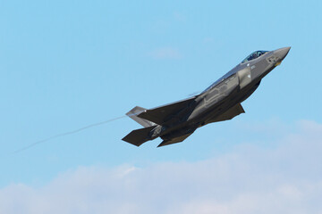 Fototapeta na wymiar Take off and climb of a F-35A