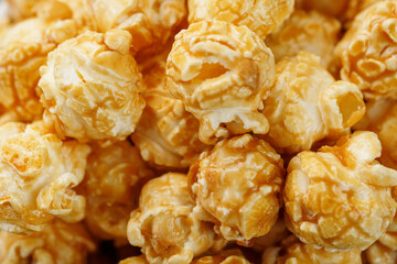 Popcorn in caramel glaze macro as a background.