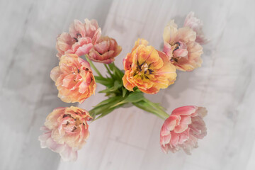 Fresh Bouquet of beautiful tulips on white wooden background