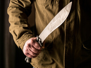 Man holding a machete in his hand